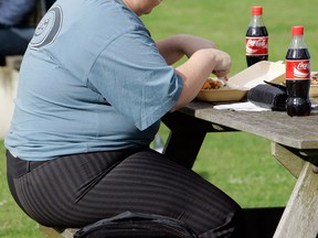 Soda pop is virtually powerless to give the body that "full" feeling. (Kirsty Wigglesworth / Associated Press files)