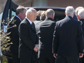 Lou Lamoriello, second from left, president and general manager of the New Jersey Devils is shown at the funeral service of Marcel Pronovost on Friday, May 1, 2015, in Windsor, Ont. (DAN JANISSE/The Windsor Star)