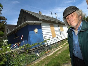Warren Smith is seen in front of the home he was forced to leave after the building was condemned in Windsor on Thursday, May 14, 2015. Smith who has been renting the home for 30 years is staying in a hotel but would like to return to his home.             (TYLER BROWNBRIDGE/The Windsor Star)