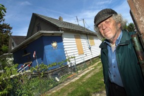 Warren Smith is seen in front of the home he was forced to leave after the building was condemned in Windsor on Thursday, May 14, 2015. Smith who has been renting the home for 30 years is staying in a hotel but would like to return to his home.             (TYLER BROWNBRIDGE/The Windsor Star)