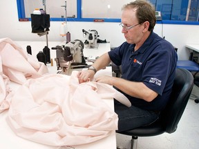 A Takata employee sews an airbag at Takata's current crash-testing facility August 19, 2010 in Auburn Hills, Michigan. . (Bill Pugliano/Getty Images)