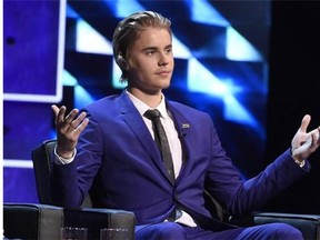 Justin Bieber appears on stage at the Comedy Central Roast of Justin Bieber at Sony Pictures Studios on Saturday, March 14, 2015, in Culver City, Calif. Lawyers for Bieber claim a Toronto limousine driver suing the Canadian pop star made up a story about being assaulted by the singer in the hopes of getting a hefty payout. THE CANADIAN PRESS/ AP/Photo by Chris Pizzello/Invision/AP