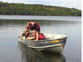 A field crew takes samples in Lake 260 in a 2012 handout photo. The lead researcher of a new study is calling for improvements to some of Canada's waste water treatment facilities after finding that introducing the birth control pill in waterways created a chain reaction in a lake ecosystem that nearly wiped out a freshwater fish. (Postmedia News files)