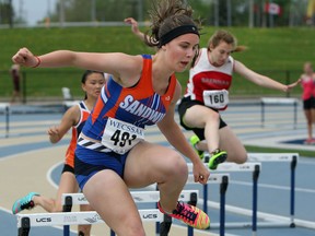 Skylar Cattrysse leads the pack during a WECSSAA Track and Field meet at Alumni Field at the University of Windsor on Monday, May 11, 2015.              (TYLER BROWNBRIDGE/The Windsor Star)