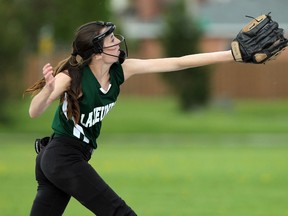 Ecole E.J. Lajeunesse's Madeline Scott reaches out but can't make the catch while taking on Hon W C Kennedy during high school slow pitch at Bellewood Park in Windsor on Monday, May 11, 2015.              (TYLER BROWNBRIDGE/The Windsor Star)