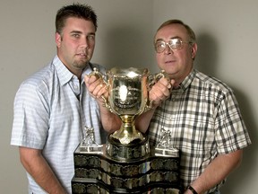 Rangers scout Brent Sadler, left, and his father Mike pose with the Memorial Cup in 2003. (Star file photo)