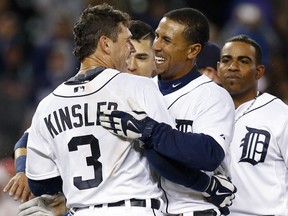 Detroit Tigers' Ian Kinsler (3) celebrates his game winning single with Anthony Gose, right, who scored on the hit from second base against the Minnesota Twins in the tenth inning of a baseball game in Detroit Tuesday, May 12, 2015. Detroit won 2-1. (AP Photo/Paul Sancya)