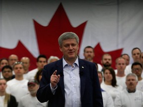 Prime Minister Stephen Harper, centre, delivers his message to assembled guests and workers at Valiant Corp. where he highlighted Canada's plan for manufacturers May 14, 2015. (NICK BRANCACCIO/The Windsor Star)