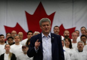 Prime Minister Stephen Harper, centre, delivers his message to assembled guests and workers at Valiant Corp. where he highlighted Canada's plan for manufacturers May 14, 2015. (NICK BRANCACCIO/The Windsor Star)