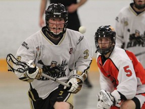 Windsor Clippers Phil Ristoski keeps his eye on the ball as Point Edward Pacers Jacob Couglin gives chase during Ontario Junior B Lacrosse action on May 13, 2015 at Forest Glade Arena. (JASON KRYK/The Windsor Star)