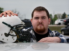Gridiron star Jack Kinney, 19, will tackle Hodgkin's lymphoma with the same energy he displayed on the field, hoping to bring awareness for teenagers to "always be aware of their bodies" Friday May 15, 2015. (NICK BRANCACCIO/The Windsor Star)