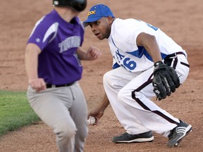 Tecumseh Thunder's Casey Boutette is caught between first and second base as  Troy Jet Box second baseman Ty Youngblood stops the baseball on May 15, 2015. (JASON KRYK/The Windsor Star)