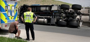 A tanker carrying 8,000 pounds of grape concentrate tipped over on the Herb Gray Parkway roundabout  Sunday, May 17.  (NICK BRANCACCIO/The Windsor Star)
