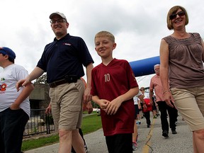 Mayor Drew Dilkens, left, with son, Jack and wife Jane Deneau during the Mayor's Walk along the Windsor riverfront on Victoria Day, Monday May 18, 2015.  (NICK BRANCACCIO/The Windsor Star).