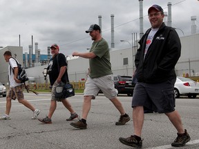 Fiat Chrysler Windsor Assembly Plant workers prepare to leave on their first day back from a lengthy shutdown May 19, 2015.  Windsor Assembly Plant or Plant 3 was retooled for the ever-popular Chrysler minivan, the next generation minivan and a new product. (NICK BRANCACCIO/The Windsor Star).