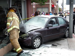 A four-door Honda Civic rests inside the front entrance of Royal Pita on Wyandotte Street East at Louis Ave. Thursday May 21, 2015. Wyandotte Street was blocked in both directions until emergency crews could sort out details of the multi-vehicle crash. Windsor firefighters, Windsor Police and Essex-Windsor EMS paramedics all responded to the incident. (NICK BRANCACCIO/The Windsor Star).
