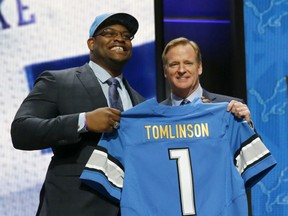 Duke offensive lineman Laken Tomlinson poses for photos with NFL commissioner Roger Goodell after being selected by the Detroit Lions as the 28th pick in the first round of the 2015 NFL Draft,  Thursday, April 30, 2015, in Chicago. (AP Photo/Charles Rex Arbogast)