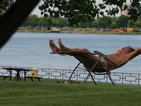 Jerry Janosik enjoys a beautiful afternoon on the Windsor riverfront at Alexander Park Thursday May 28, 2015. Already bronzed, Janosik recently spent a few weeks in Cayo Santa Maria, Cuba, taking a direct flight from Windsor Airport. (NICK BRANCACCIO/The Windsor Star)