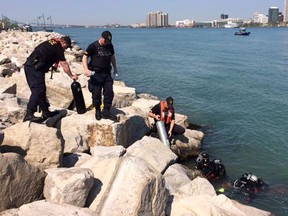 Divers scoured the Detroit River on Thursday, May 7, 2015 as part of an ongoing Windsor Police investigation. (Dan Janisse/The Windsor Star)