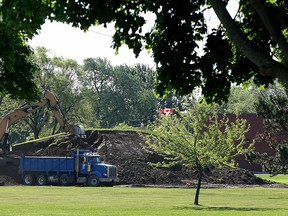 An excavator removes dirt from Long Park Hill May 27, 2015. The earth is being relocated to Ford Test Track. (NICK BRANCACCIO/The Windsor Star).