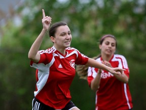 Brennan Cardinals Jaclyn French, left, celebrates her goal against Walkerville in senior girls soccer at Brennan field Monday May 19, 2015.  (NICK BRANCACCIO/The Windsor Star)