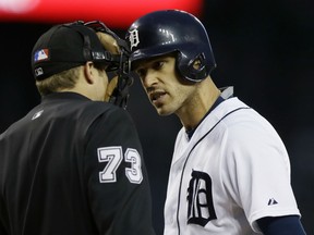 Detroit Tigers' Ian Kinsler argues the strike zone with umpire Tripp Gibson during the fifth inning of an interleague baseball game against the Milwaukee Brewers, Tuesday, May 19, 2015, in Detroit. (AP Photo/Carlos Osorio)