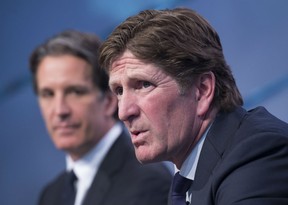 Toronto Maple Leafs new head coach Mike Babcock, right, speaks to reporters with president Brendan Shanahan during a press conference in Toronto on Thursday, May 21, 2015. THE CANADIAN PRESS/Darren Calabrese