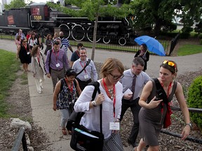 Delegates from the Governor General's Canadian Leadership Conference leave Spirit of Windsor locomotive exhibit on Windsor's riverfront during a tour of  Windsor initiatives and transformations with the hope of broadening the perspectives of our future leaders Monday May 25, 2015.  (NICK BRANCACCIO/The Windsor Star).