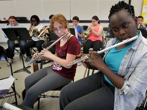 Begley Public School music students Carli Roberts, left, and Nana Badri, play during lunch hour rehearsal Thursday May 28, 2015. (NICK BRANCACCIO/The Windsor Star).