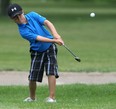 Tyler Hurtubise, 8, chips onto the green on the 7th hole at the Southland Junior Golf Tournament at Little River Golf Course, Saturday, July 9, 2011.    (DAX MELMER / The Windsor Star)