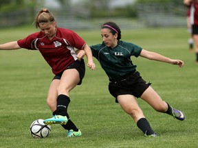 Lajeunesse's Micheala Difranco (right) tries to steal the ball from North Lambton Secondary School's Nicole Rogers at McHugh Park in Windsor on Wednesday, May 27, 2015.              (TYLER BROWNBRIDGE/The Windsor Star)