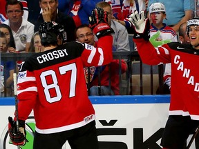 Taylor Hall #4 of Canada celebrate with his team mate Sidney Crosby after scoring the opening goal during the IIHF World Championship semi final match between Canada and Czech Republic at O2 Arena on May 16, 2015 in Prague, Czech Republic.  (Photo by Martin Rose/Bongarts/Getty Images)