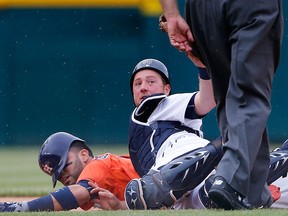 Tigers catcher Bryan Holaday, right, attempts to put the tag on Marwin Gonzalez of the Houston Astros during a run down in the eighth inning on May 24, 2015 at Comerica Park in Detroit, Michigan. (Photo by Leon Halip/Getty Images)