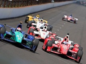 Charlie Kimball, driver of the #83 Chip Ganassi Racing Teams Chevrolet Dallara, races ahead of a pack of cars during the 99th running of the Indianapolis 500 at Indianapolis Motorspeedway on May 23, 2015 in Indianapolis, Indiana. (Photo by Jamie Squire/Getty Images)