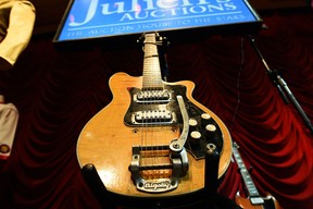 Musician George Harrison's Mastersound Electric guitar is pictured before an auction start at the Hard Rock Cafe in New York on May 15, 2015. The guitar played by Harrison in the Beatles' early days, previously on display in a British museum, goes on auction in New York on May 15, valued at $400,000 to $600,000 USD. The electric guitar is the two-day auction's star item, amid hundreds of possessions once owned by rock 'n' roll's biggest stars, which auctioneers hope will rake in millions. AFP PHOTO/JEWEL SAMADJEWEL SAMAD/AFP/Getty Images