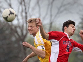General Amherst's  Jessie Heywood, left,   goes up against  Ste. Cecile's Dylan Hussey during the WECSSAA boys soccer game at Ste. Cecile on May 4, 2015 in Windsor, Ontario. (JASON KRYK/The Windsor Star)