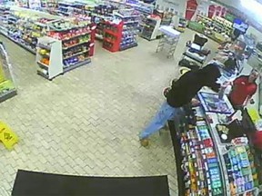 A security camera image of a robbery at the 7-Eleven on Erie Street South in Leamington on May 2, 2015. (Handout / The Windsor Star)