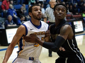 Catholic Central grad Michael Mulder, left, blocks out during a Vincennes University game. (MATT GRIFFITH/Vincennes University)