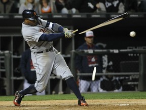 Rajai Davis #20 of the Detroit Tigers breaks his bat as he hits an RBI fielders choice against the Chicago White Sox during the sixth inning on May 6, 2015 at U.S. Cellular Field in Chicago, Illinois. (Photo by David Banks/Getty Images)