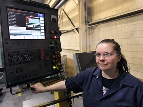 Delina Rees, a metal cutting apprentice is shown at H. Beck Machinery Ltd. in Windsor, on Monday, May 11, 2015. She is encouraging other women to consider skill trades as an option. (DAN JANISSE/The Windsor Star)