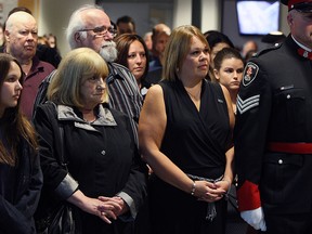 John Atkinson's widow Shelley Atkinson (right) stands next to his mother Charmaine Atkinson during a service for the late Const. John Atkinson at Windsor Police headquarters in Windsor on Tuesday, May 5, 2015. (TYLER BROWNBRIDGE/The Windsor Star)