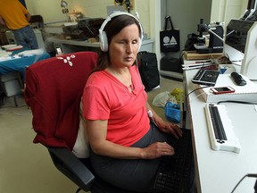 Rebecca Blaevoet works on the company website at Tactile Vision Graphics in Windsor on Tuesday, May 19, 2015. Blaevoet is upset with Transit Windsor after a bus driver refused to help the blind woman find her stop.              (TYLER BROWNBRIDGE/The Windsor Star)