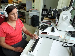 Rebecca Blaevoet works on the company website at Tactile Vision Graphics in Windsor on Tuesday, May 19, 2015. Blaevoet is upset with Transit Windsor after a bus driver refused to help the blind woman find her stop.              (TYLER BROWNBRIDGE/The Windsor Star)