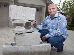 Tony Azar,  of Azar Block Inc., is pictured with mortarless blocks, Tuesday, May 12, 2015.  Because the blocks don't require mortar, skilled labour is not needed to build with them.  (DAX MELMER/The Windsor Star)