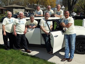 Brothers Kim, Chris, Todd (back row left to right), Larry, Garry, Jeff, Scott and Steven Belanger (front left to right) recreate a Windsor Star photo that was originally taken in 1965 in Windsor on Saturday, May 2, 2015.                   (TYLER BROWNBRIDGE/The Windsor Star)