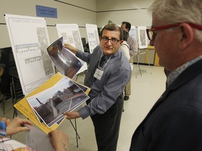 Mike Mastronardi, Project Manager at Stantec Consulting Ltd., speaks with Windsor residents during a public information meeting for the City of Windsor Central Box Study Area Class Environmental Assessment.  The meeting was held at the Columbus Centre in South Windsor. (JASON KRYK/The Windsor Star)