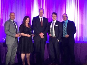 The Star's Tyler Brownbridge, left, Carolyn Thompson, Dylan Kristy, second from right, and Don McArthur accept their ONA for their four-part series Windsor Gone.