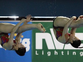 China's Han Wang and Zi He compete in the women's 3m synchro springboard event at the Fina Diving World Series at the Windsor International Aquatic and Training Centre in Windsor on Friday, May 22, 2015. (TYLER BROWNBRIDGE/The Windsor Star)