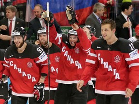 Canada’s Sidney Crosby, center, and team mates celebrate after defeating Russia in the Hockey World Championships gold medal match in Prague, Czech Republic, Sunday, May 17, 2015. (AP Photo/Petr David Josek)