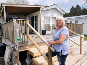 Debby Robert stands in front her trailer home at Rochester Place in Belle River. She's been informed by park management she must move the trailer by Nov. 7. (Dan Janisse / The Windsor Star)